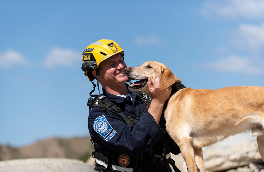National Disaster Search Dog Foundation (SDF) team member with canine partner