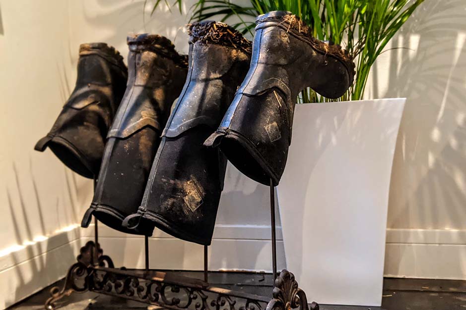 Muck boots drying upside down on a boot rack