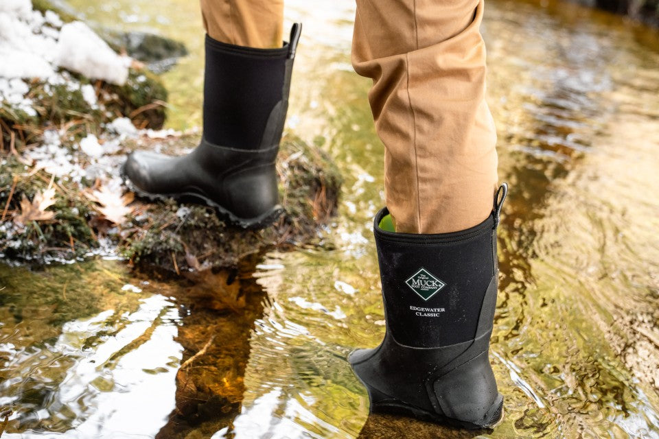 Walking through stream in black boots