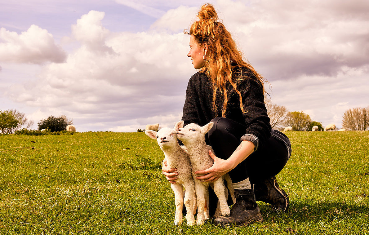Zoe C. holding two baby lambs