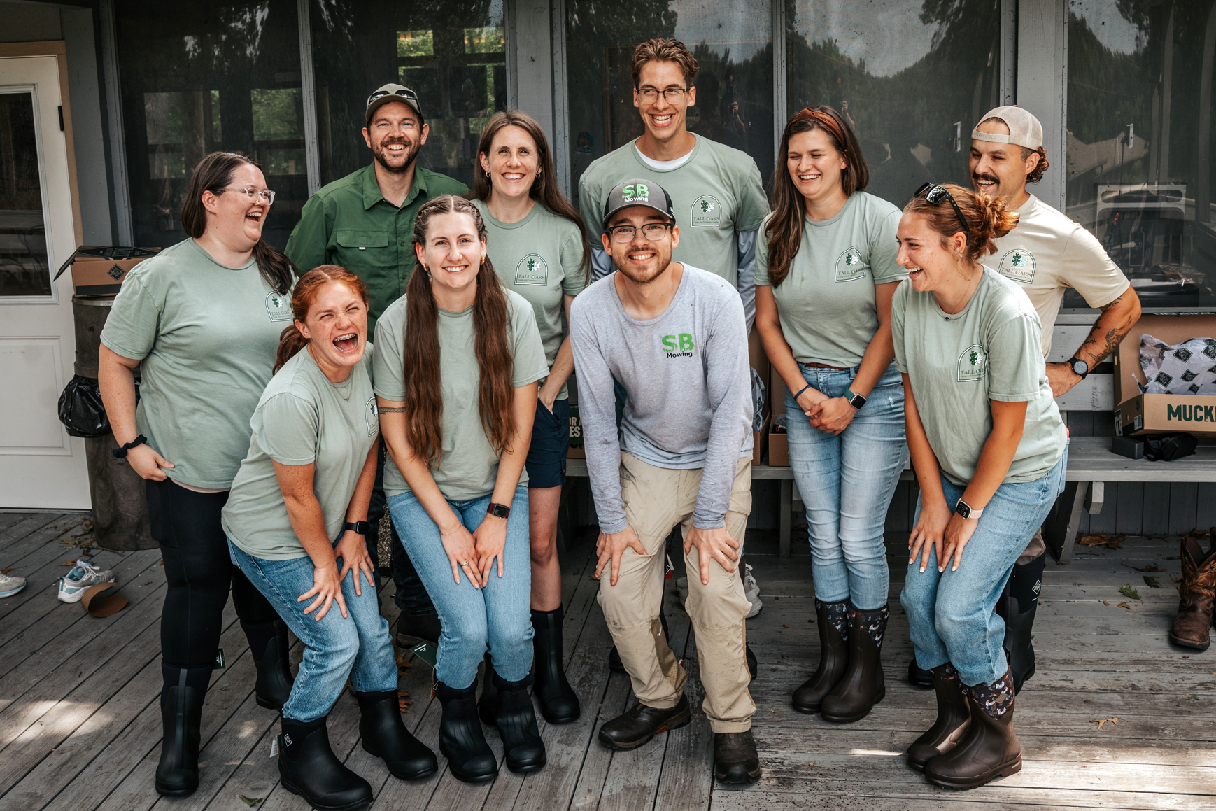 SB Mow It Forward volunteers posing together during a lawn care event