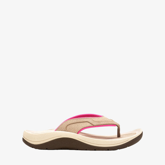 A single women's flip-flop sandal shown in a side profile on a white background. The sandal features a beige woven upper strap with a vibrant hot pink accent, resting on a thick beige footbed and a dark brown outsole.