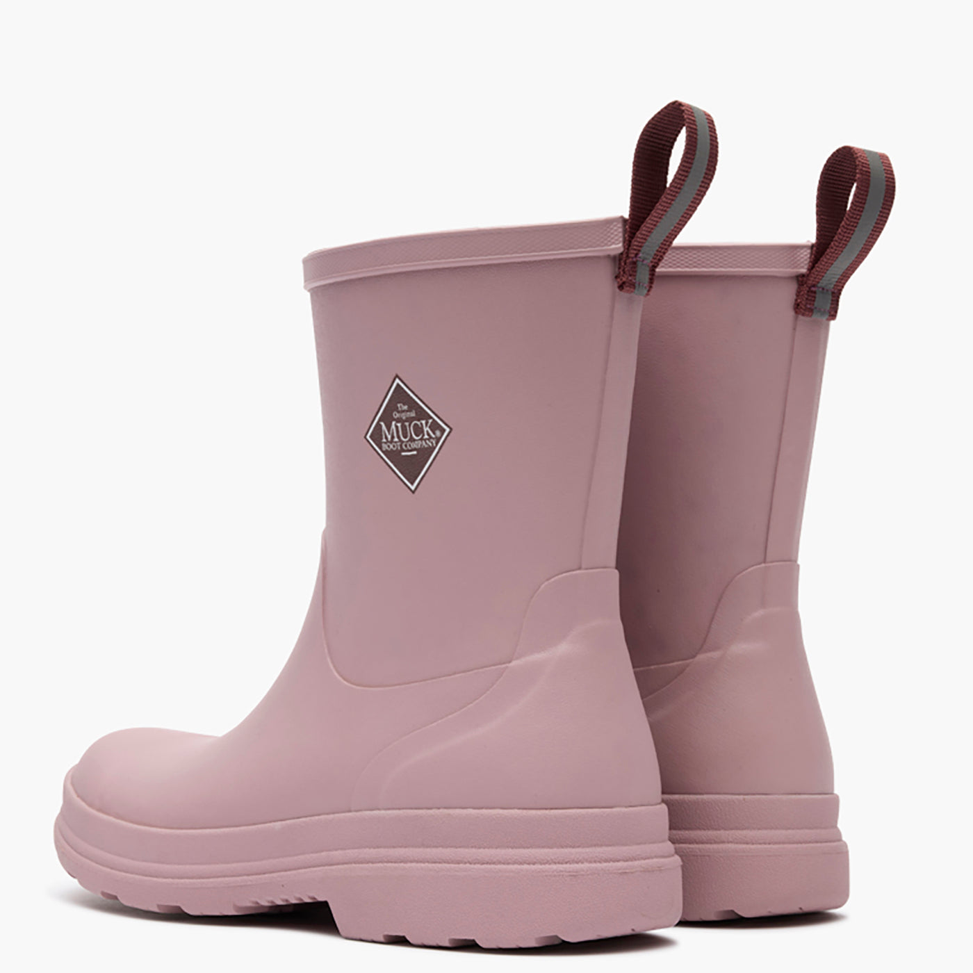 Pair of pink rubber boots with a brand logo on a white background