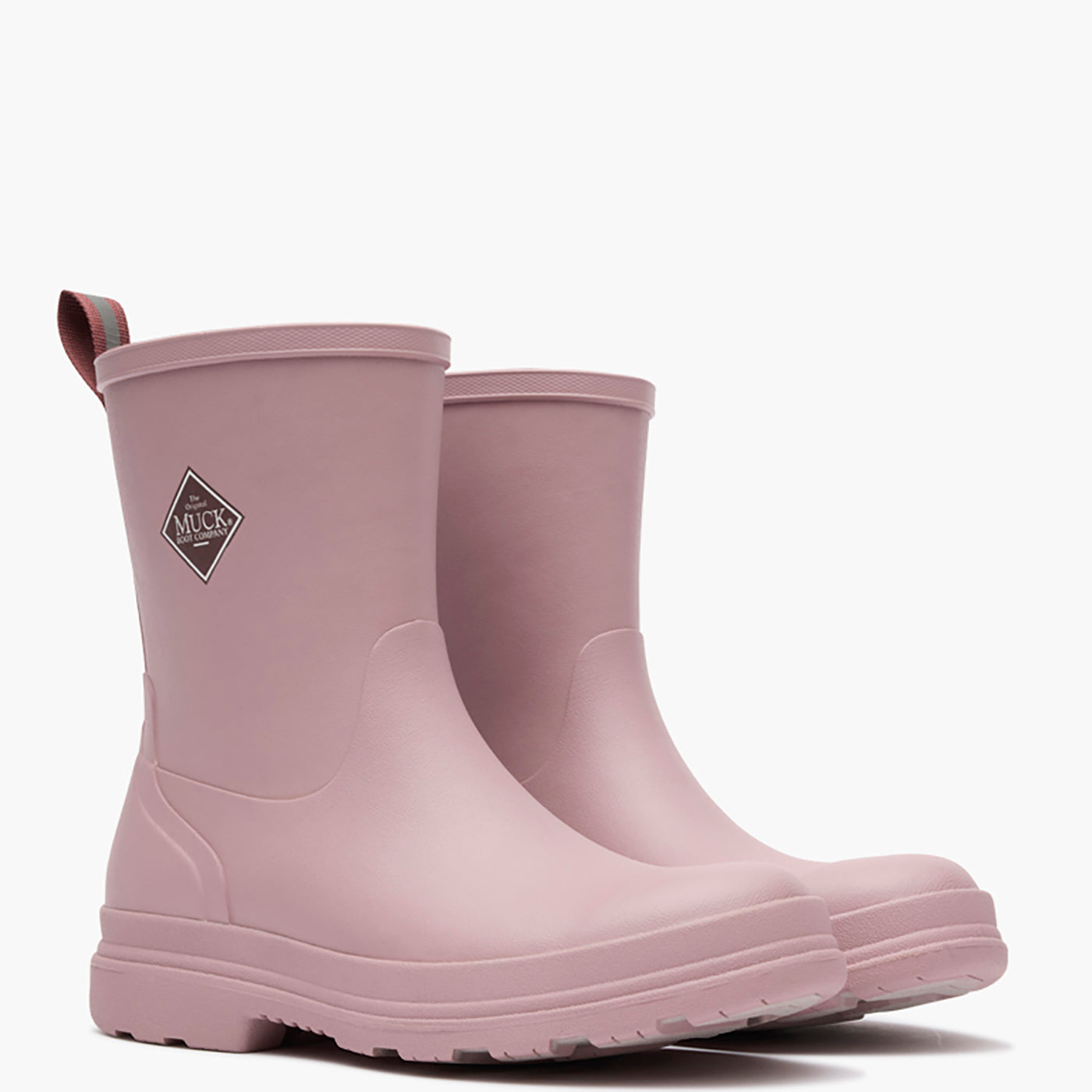 Pair of pink rubber boots with a brand logo on a white background