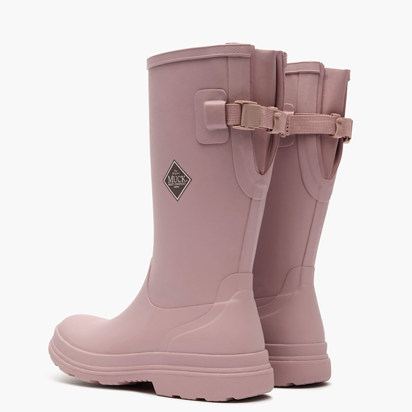 Pair of pink rubber boots with a strap on a white background