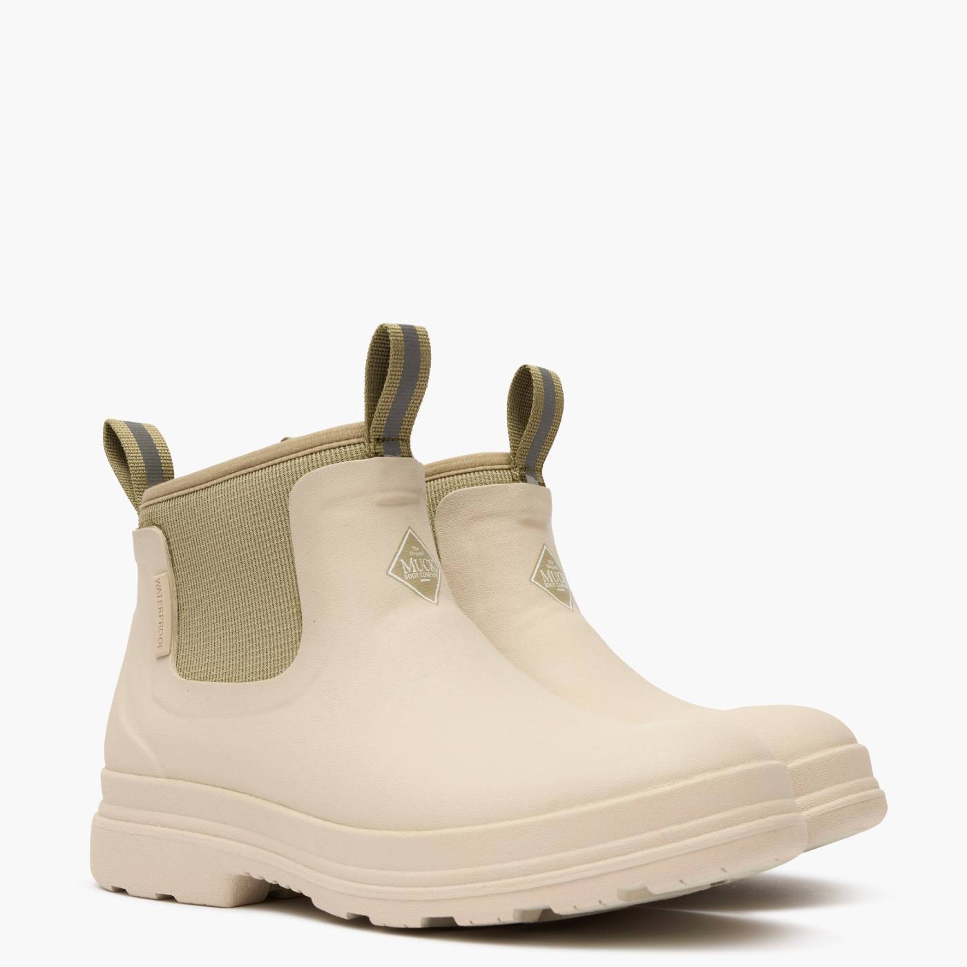 Beige rubber chelsea boots with matching neoprene.