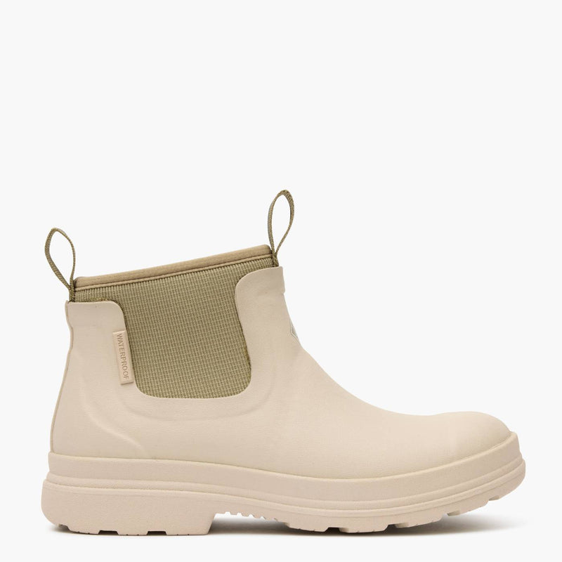 Beige rubber chelsea boot with matching neoprene.