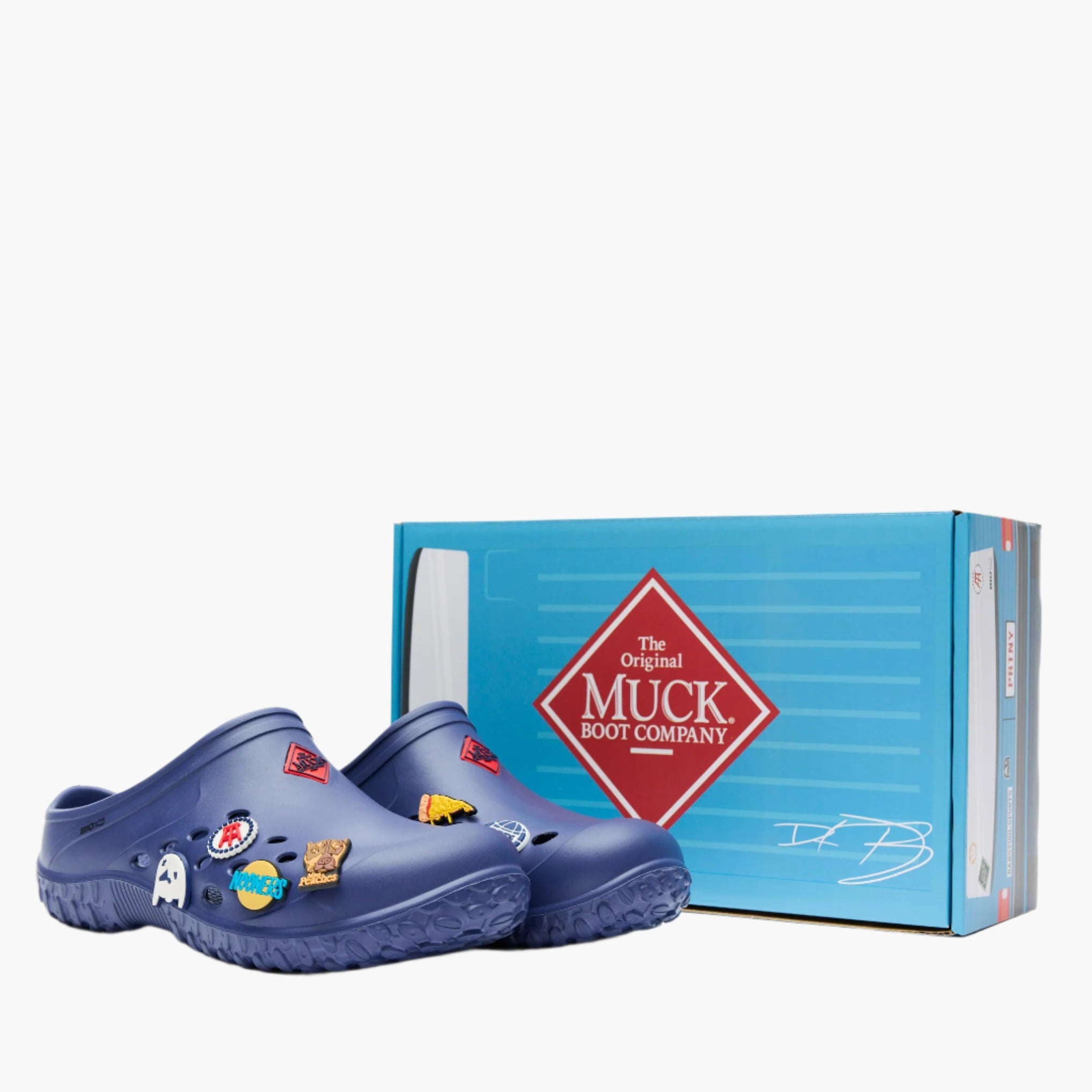 MLCMBS20 - Men's white clogs with colorful Barstool Sports tokens next to a blue Muck Boot Company box on a white background