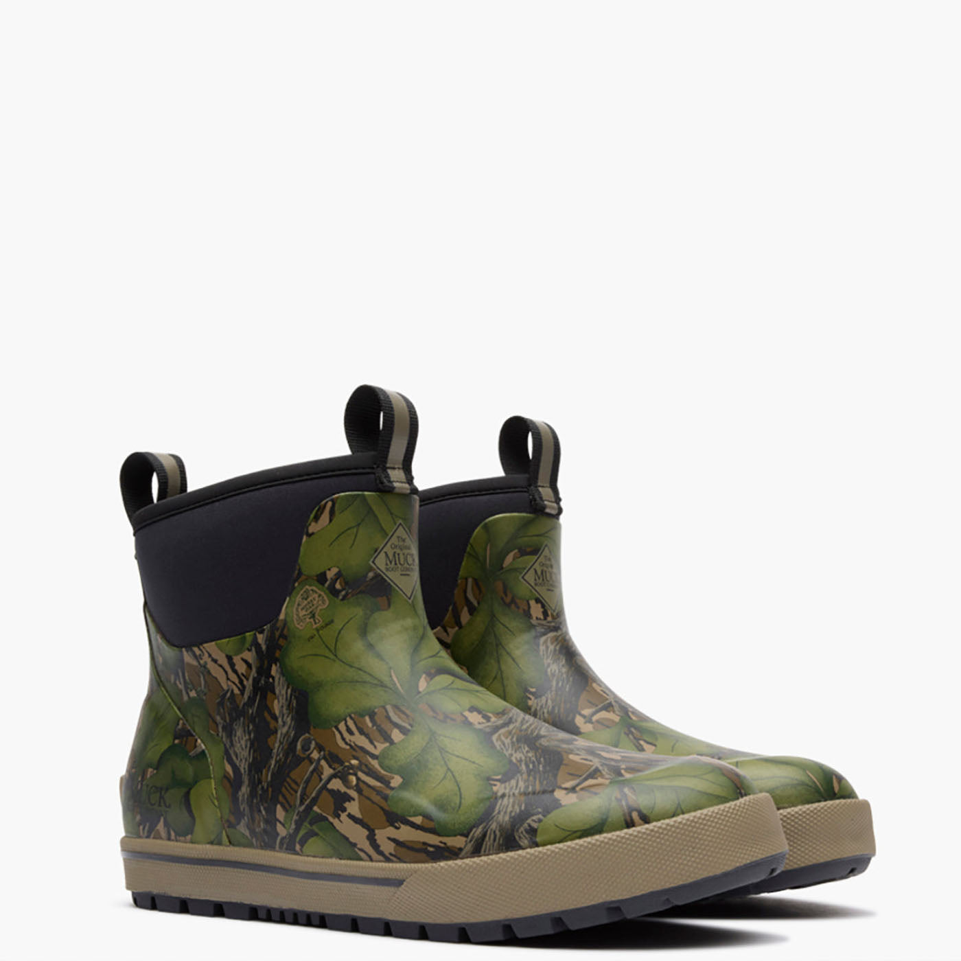 A pair of waterproof rubber boots featuring a green and brown leafy camouflage pattern, black elastic ankle cuffs, and tan soles, shown against a plain white background.