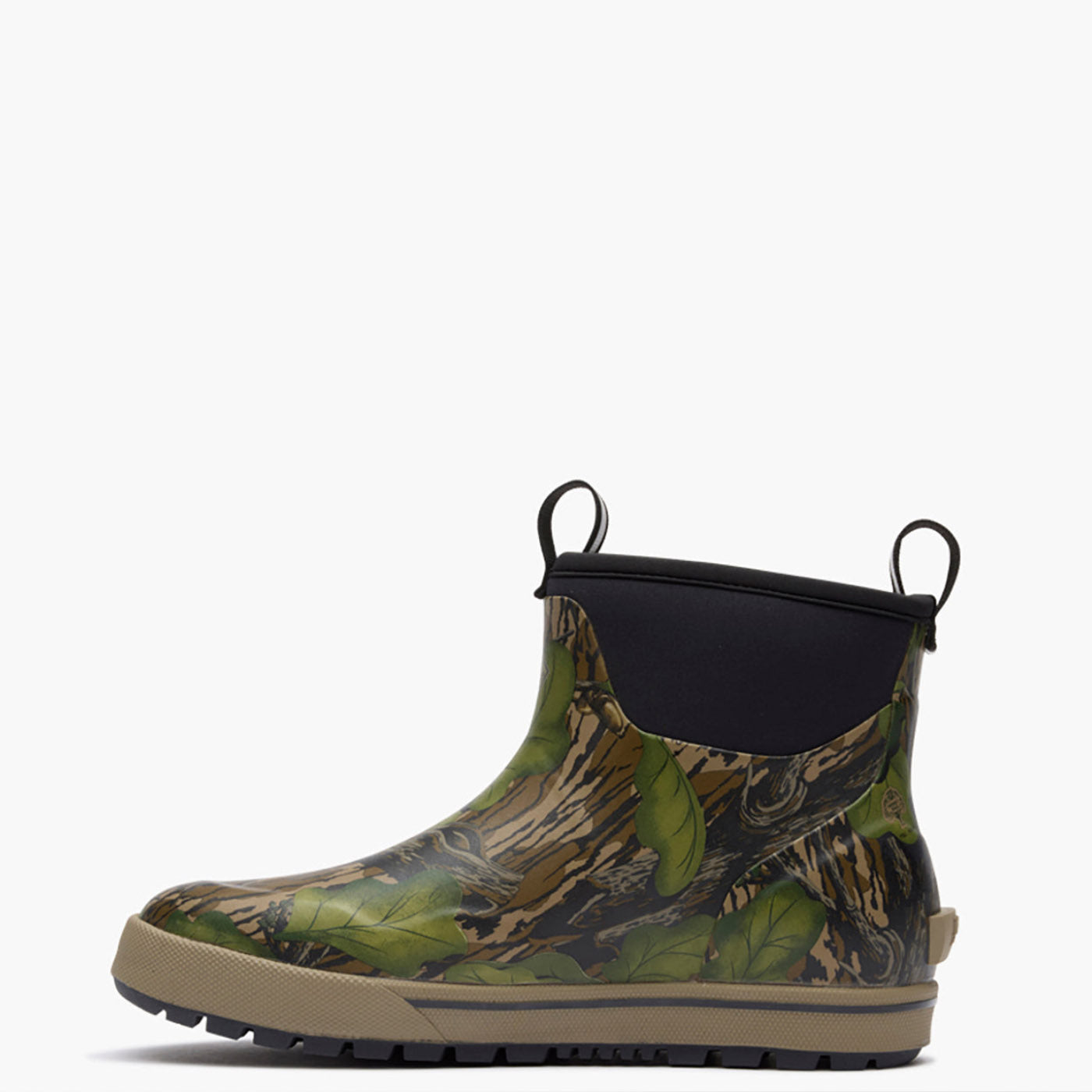 A single ankle-height rain boot with a green and brown leafy camouflage pattern, a black elastic side panel, and a beige outsole, shown against a plain white background.