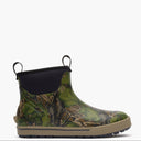 Green camouflage Muck boot with black top on a white background